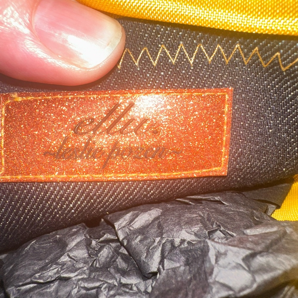 Elegant clutch purse with partial print.